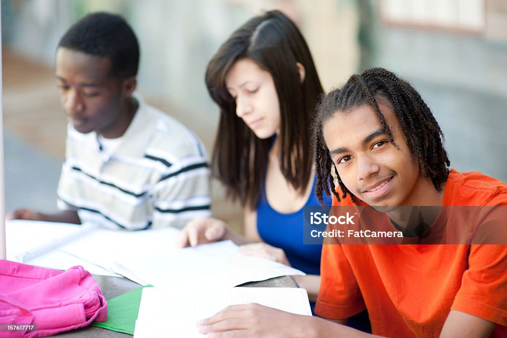 Teen students Multi racial teenagers outside. Very shallow focus. African Ethnicity Stock Photo