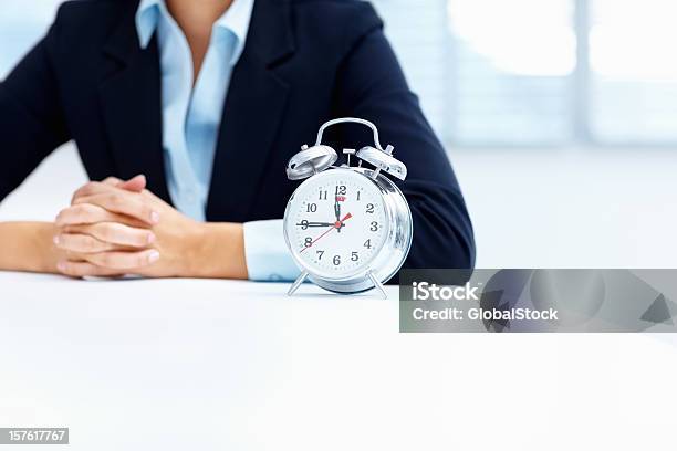 Mid Section Of A Business Woman With Alarm Clock Stock Photo - Download Image Now - Business, Human Hand, Only Women