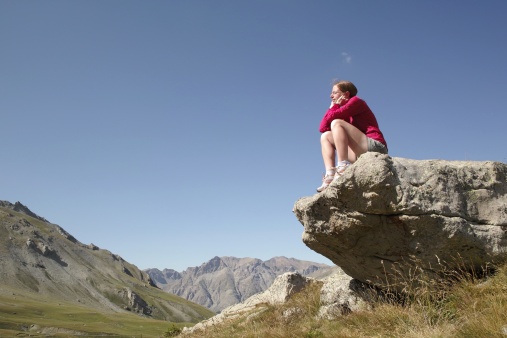 sitting on a stone in the alps in summer time in the wonderful Mercantou National Park near Col de Cayolle - summer 09 - dp1