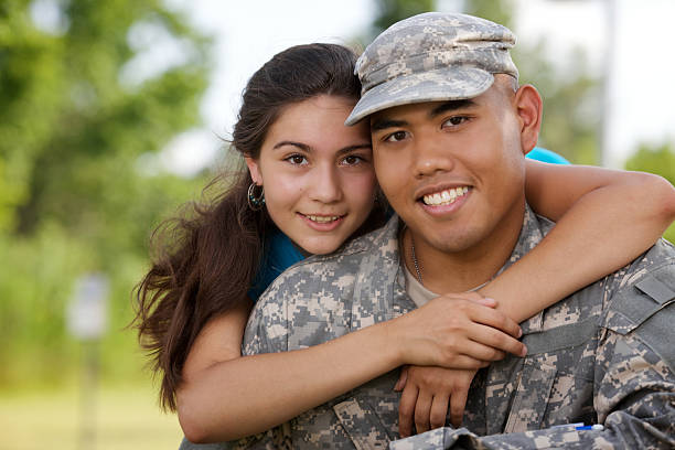 istock Military man in his uniform hugging a woman 157617868
