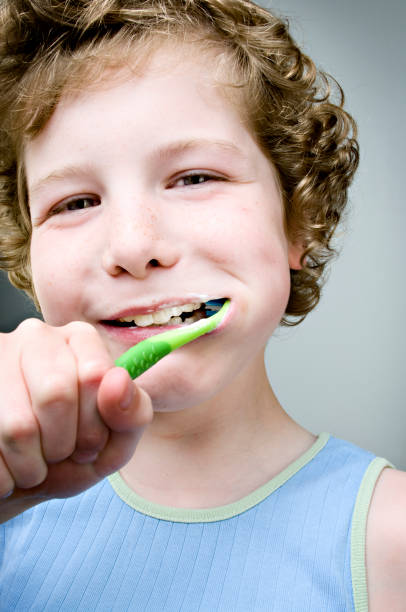 istock Dental Hygiene Young Boy Brushing Teeth 157617888