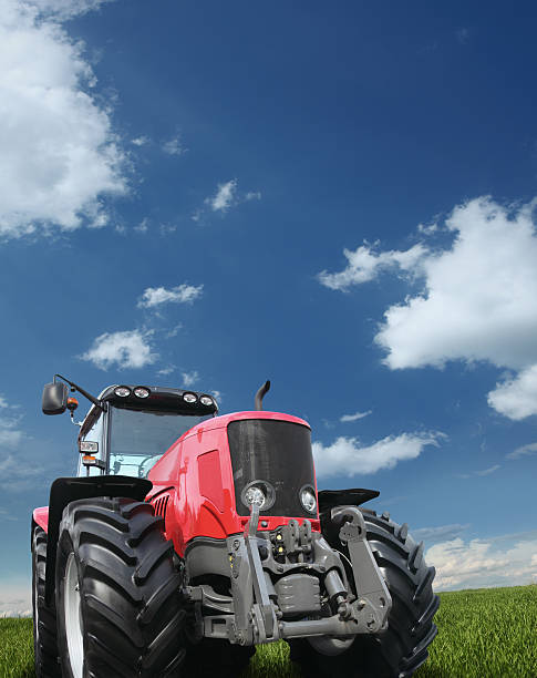 istock Tractor on the Green Field 157617926