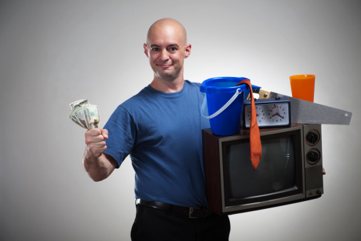 A man sells his stuff for cash! Get rid of your old stuff, get cash! Money for your stuff!