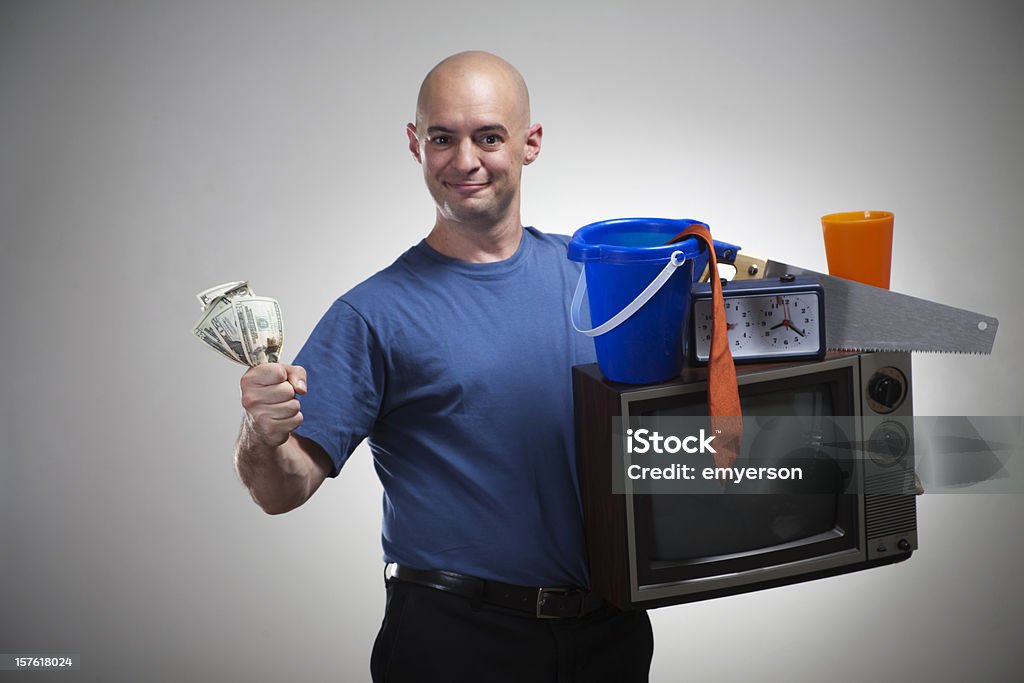 Stuff For Cash! A man sells his stuff for cash! Get rid of your old stuff, get cash! Money for your stuff! Pawnbroker Stock Photo