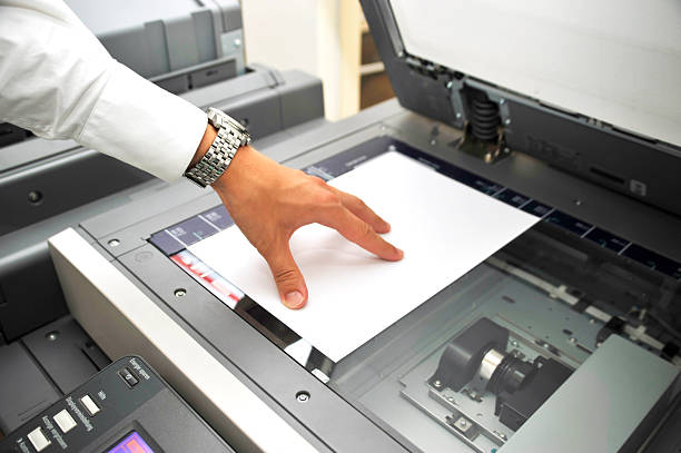 using copier human hand using copier. Close-up picture with bright light bar code reader stock pictures, royalty-free photos & images