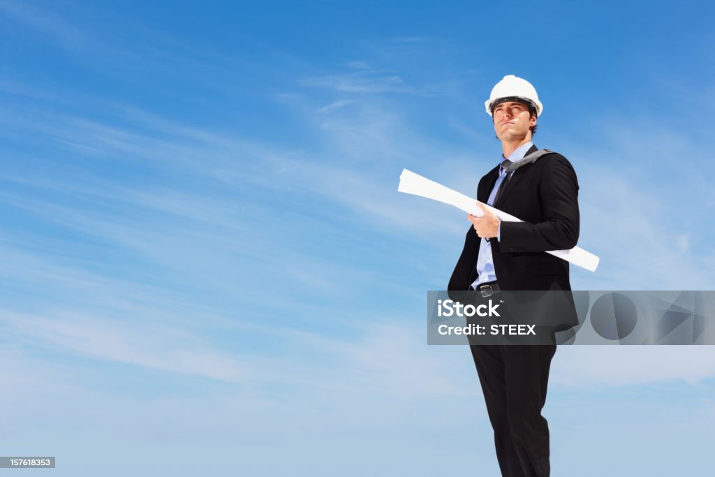 Successful architect holding a blueprint with copy space  20-29 Years Stock Photo