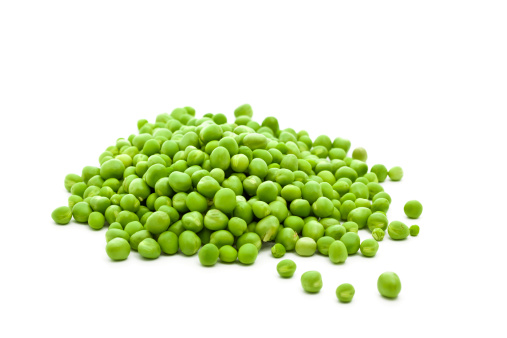 close-up of fresh green peas isolated on white