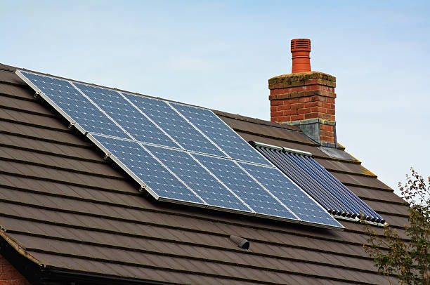 istock Photovoltaic Solar Panels on a tiled roof 157618634
