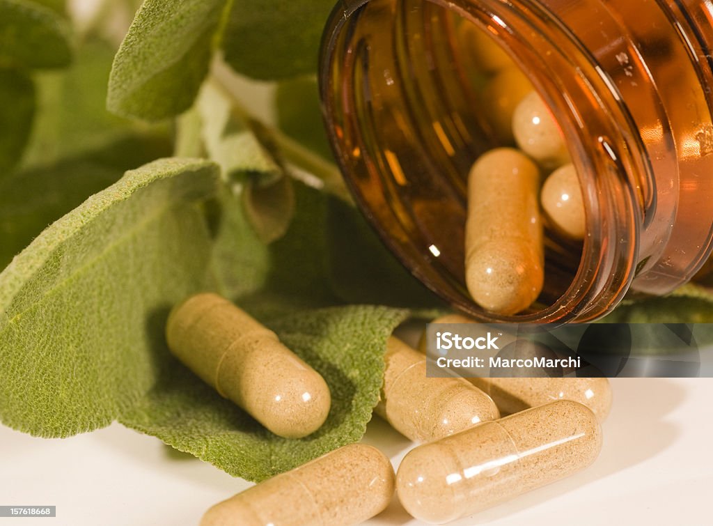 Organic pills Herbal medicine isolated on white Capsule - Medicine Stock Photo