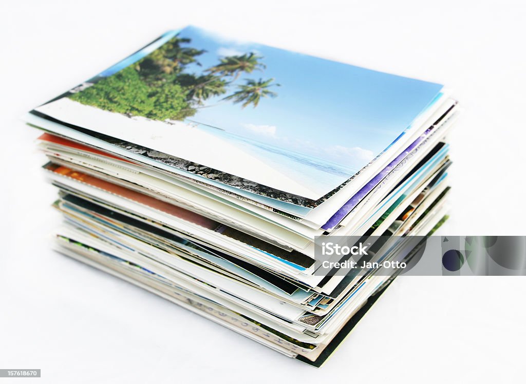 Stack of postcards A stack of postcards. Image on top is on Maldives. Focus on edge of cards in front. Stack Stock Photo
