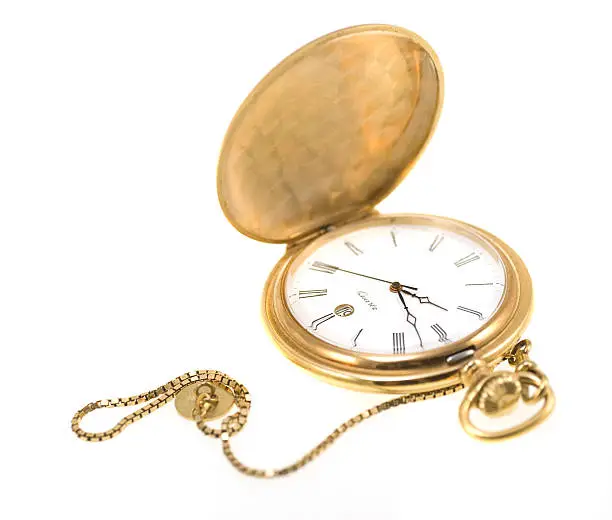 Photo of golden pocket watch isolated on white
