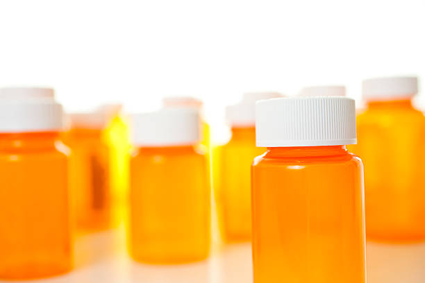 istock Group of orange medicine bottles with lids 157619099