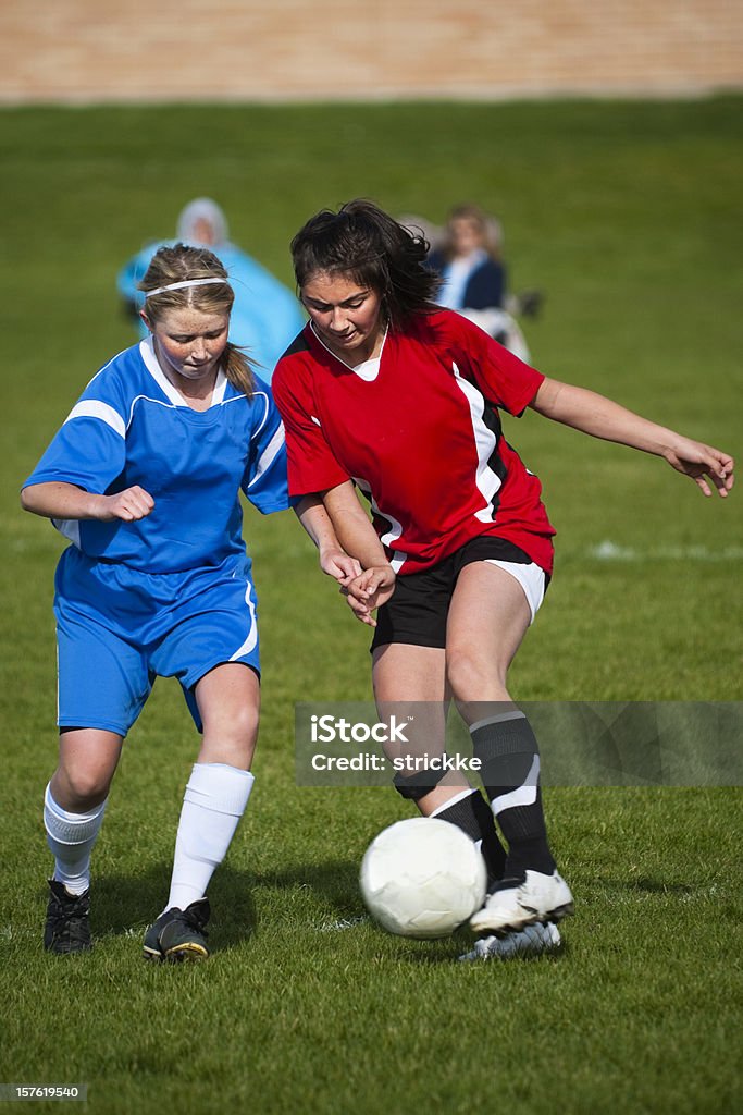 Female Soccer Players Challenge for Fifty-fifty Ball  Playing Stock Photo