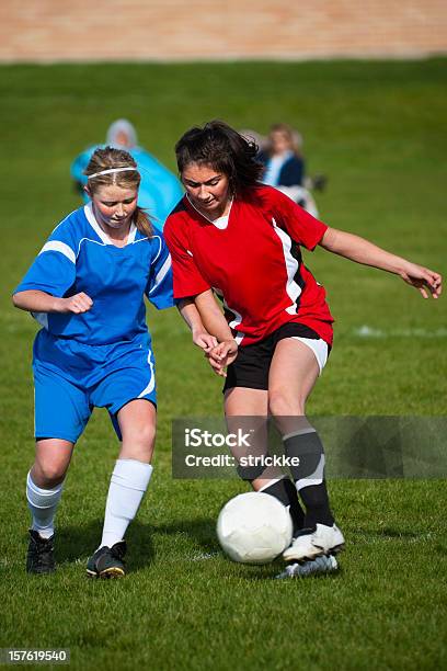 Female Soccer Players Challenge For Fiftyfifty Ball Stock Photo - Download Image Now