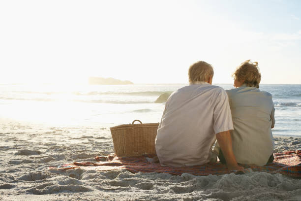 istock Old couple enjoying their vacation on beach 157619814