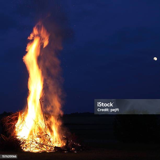 Bonfire At Midsummer With Moon In The Sky Stock Photo - Download Image Now - Bonfire, Burning, Color Image