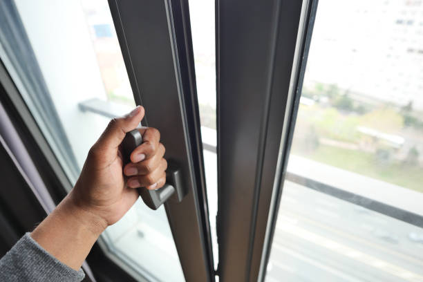 istock hand open gray plastic pvc window at home at early morning 1576203091