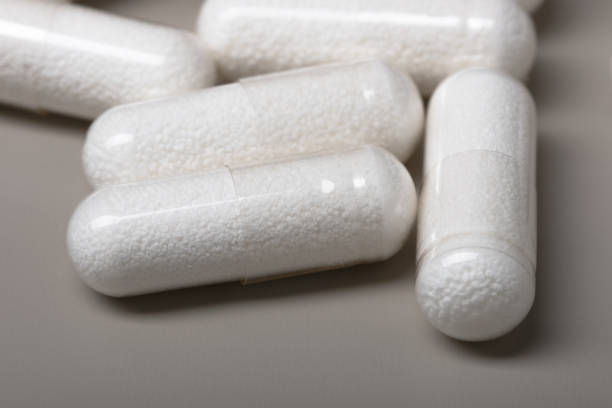 istock Medicine capsules on a gray background. 1576205379