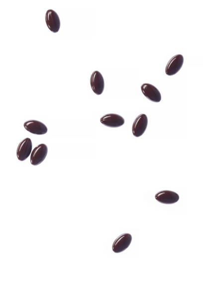 istock Falling brown fish oil in gelatin capsules. 1576207642