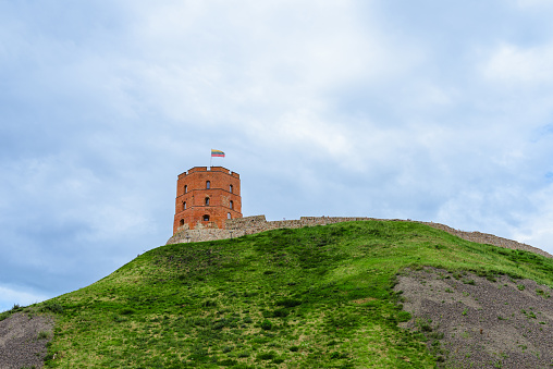 Tower of Gediminas in the summer morning In Vilnius, Lithuania.Gediminas' Tower on the hill and Flag of Lithuania during summer day in Vilnius.Vilnius,Lithuania.07-21-2023.