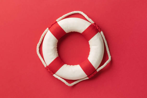 istock Lifebuoy on a red background, top view 1576216628