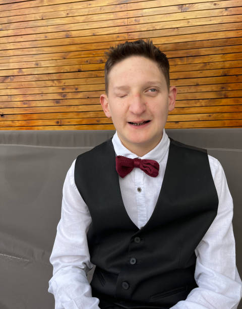 Disabled partially blind boy portrait dressed for prom