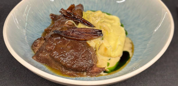istock Plate with grilled meat sauce and mashed potatoes. 1576228385