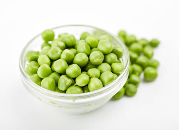 istock Fresh green pea pod with beans isolated on white background. 1576237936