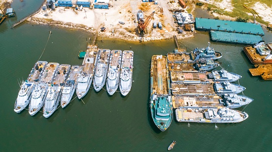 Lido di Ostia, Rome, Italy - September 2022: Row of luxury yachts mooring in a harbour