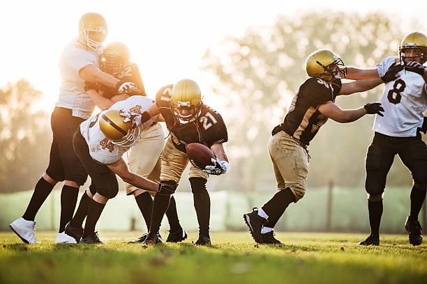 istock College Football - Catch and Tackle. 157624984