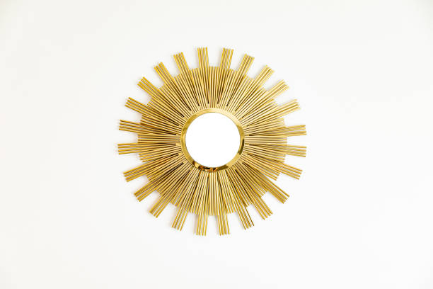 istock Beautiful modern golden mirror in shape of sun 1576252438