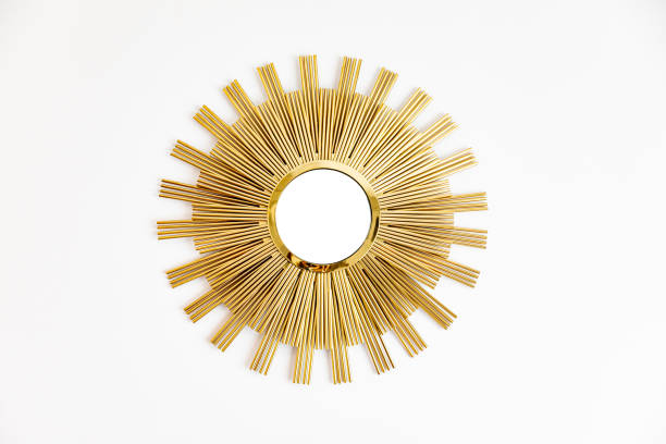 istock Beautiful modern golden mirror in shape of sun 1576252440