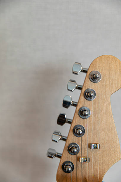 istock guitar resting against a blank grunge background with copy space 1576252976
