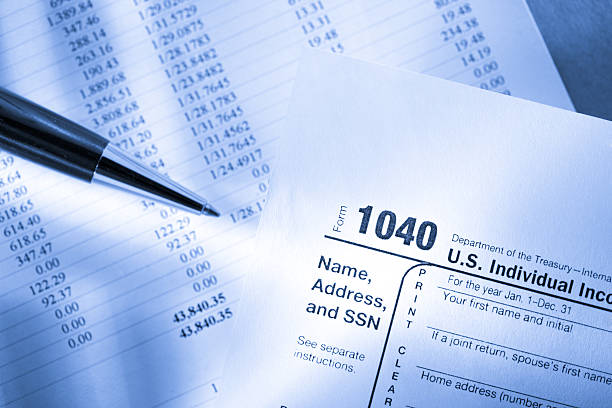 istock Tax form, operating budget and pen 157625346