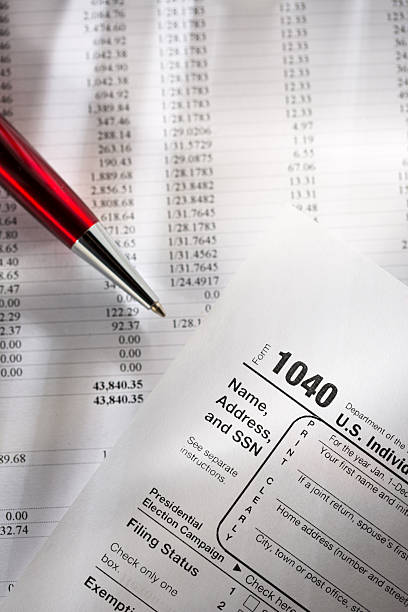 istock Tax form, operating budget and pen 157625350