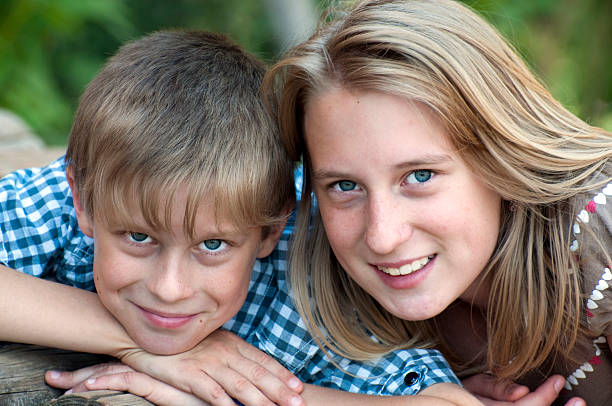 istock Happy children lying on green grass 157626323