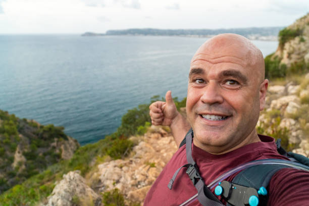 istock Happy hiker takes a selfie outdoors freedom 1576265025