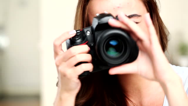 Photographer woman taking photographs dslr