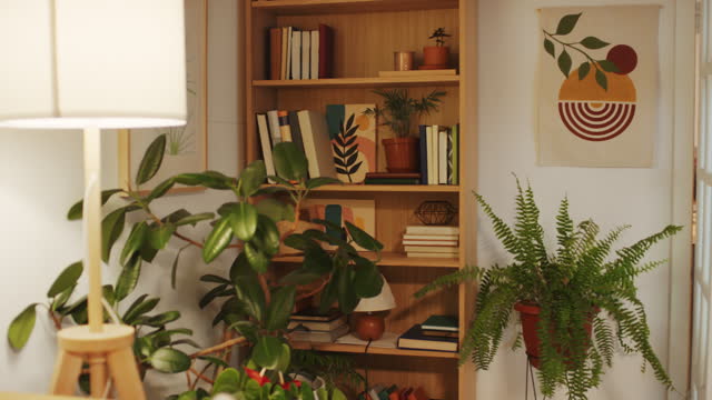 Living Room Interior with Retro Poster, Plants, Books on Shelves and Lamp