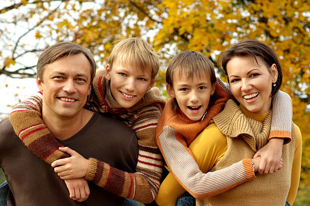 istock happy family relaxing in autumn 157627972