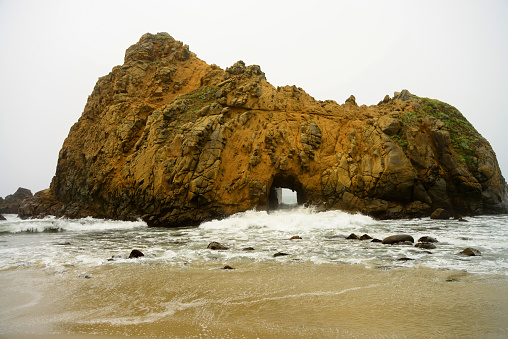 Keyhole Arch at Pfeiffer Beach on a foggy day