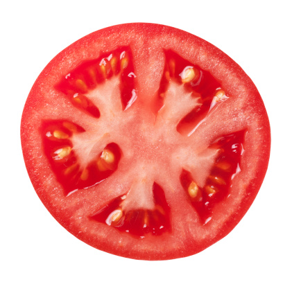 Tomato slice isolated on white background, top view