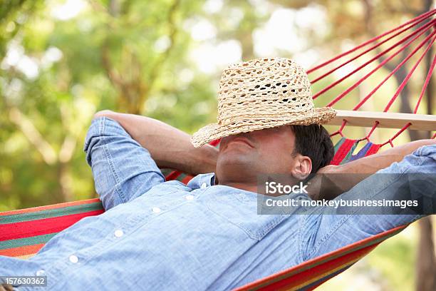 Man Lying In Hammock Stock Photo - Download Image Now - Hammock, Men, Formal Garden