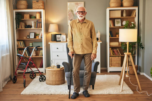 istock Elderly man with walking cane at home 1576303679