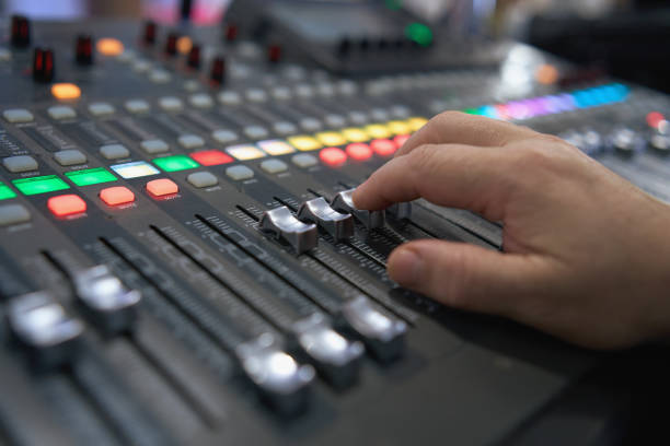 istock Professional audio mixing console. ​Mixer. Pro audio mixing board faders and knobs. Static shot of multi-track music recording equipment faders and sliders. 1576316210