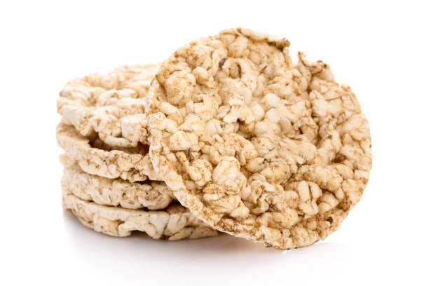 istock Puffed rice bread isolated on white background. Rice cakes. Round diet crispbreads on a white background. Round shaped cereal bread, healthy food without yeast 1576316757