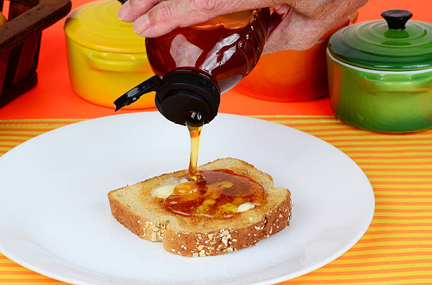 Pouring Honey on Toast