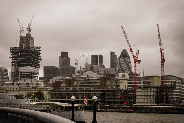 istock A battleship in a river in front of buildings 1576341812