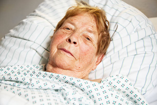 istock senior woman in hospital 157635525
