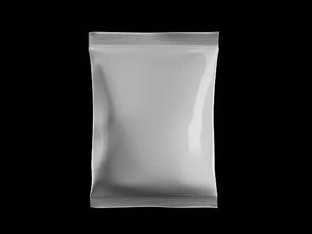 Photo of White sealed bag of candy on black background